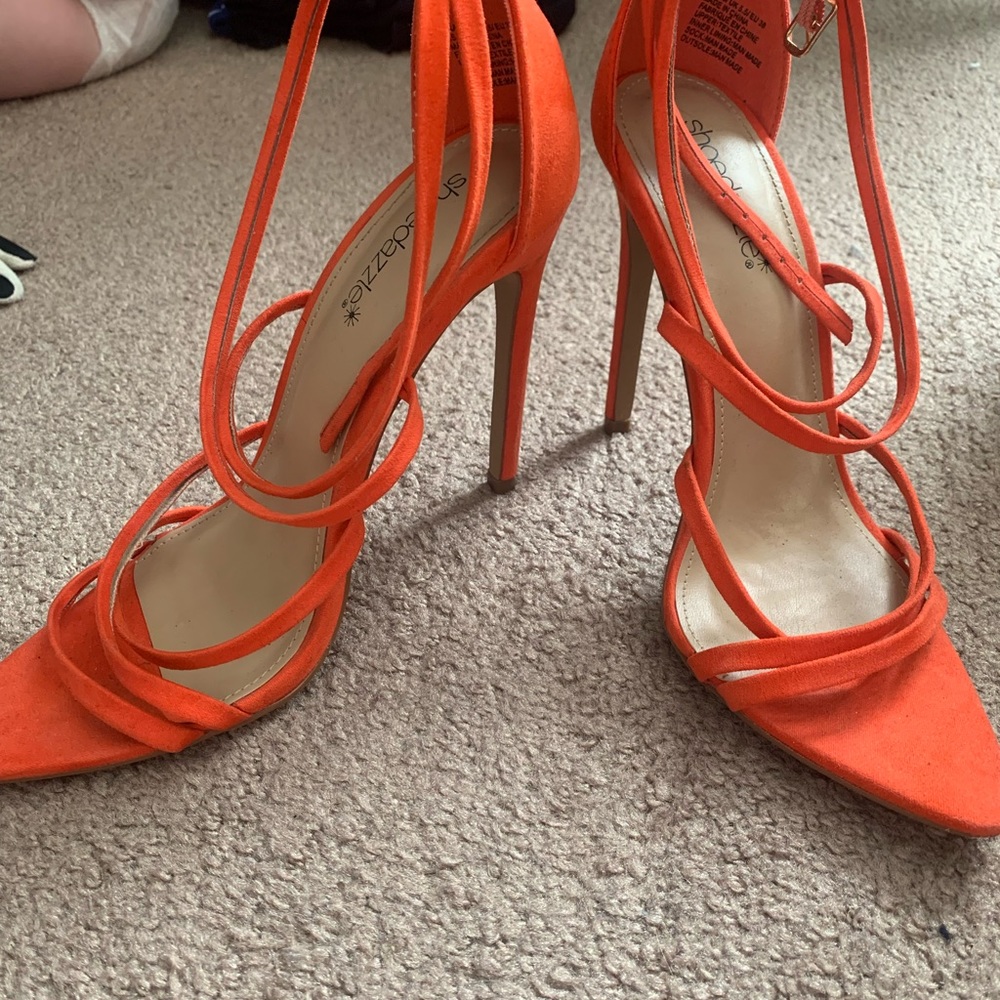 Orange strapped heel